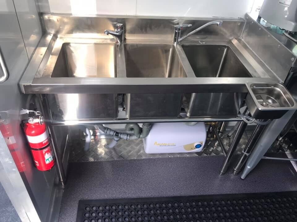 Commercial kitchen fit-out inside a custom food truck by One Stop Food Trucks
